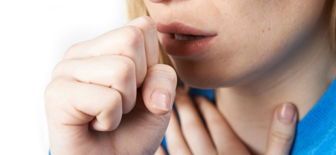 Close Up Of Woman Suffering With Cough